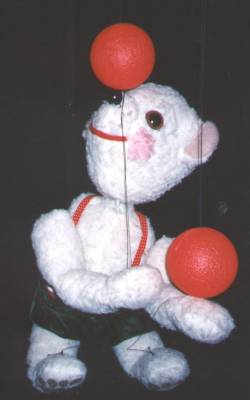 Ted E Bear balances a ball on his nose