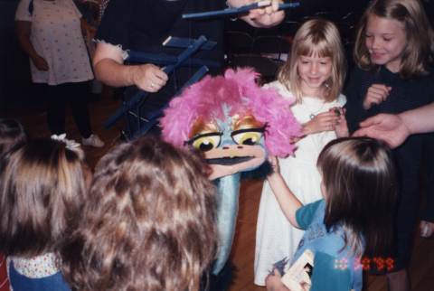 Gladys greets some children